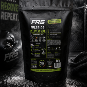 Warrior Recovery Soak magnesium bath salts by Fight Recovery Systems in a black pouch, designed to aid muscle recovery, reduce soreness, and support relaxation after training.